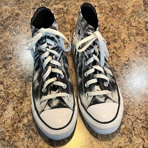 Tie dyed converse high tops.